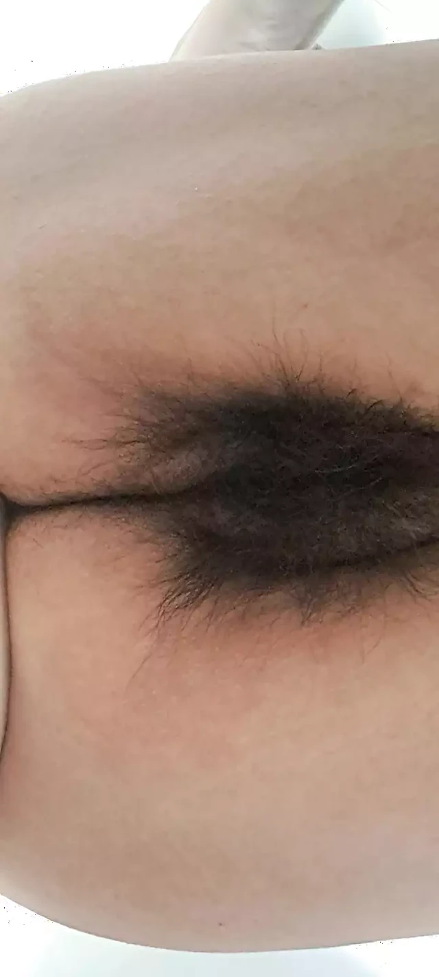Mature milf's fat, open, hairy pussy seen from below