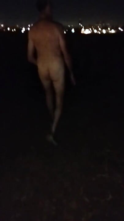 Naked Walking on the Hill Along Highway