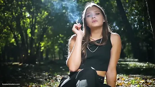 Seductive Russian Beauty Smoking Cigarette in Studio