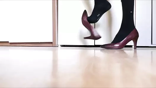 Dangling, dropping and walking in red stiletto high heels