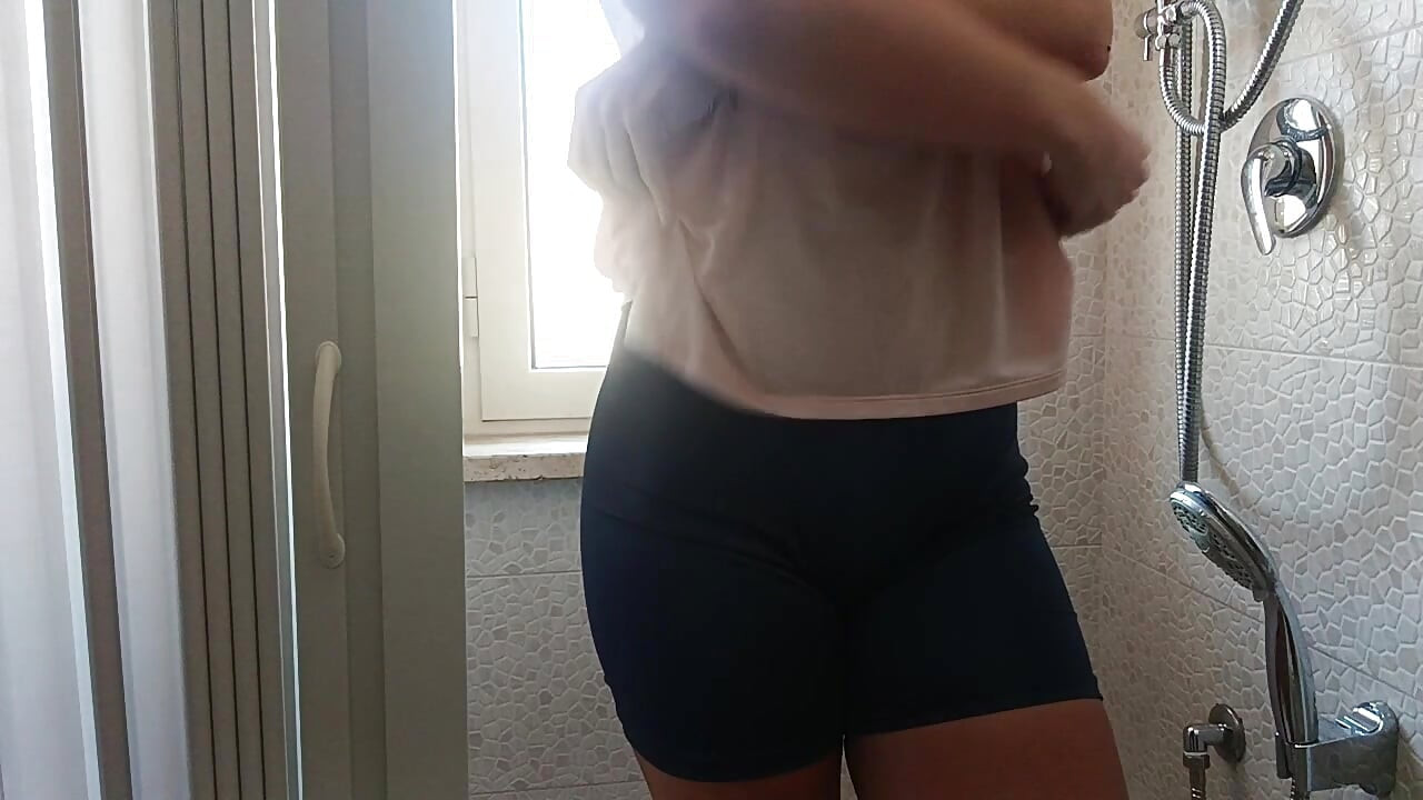 masturbation to orgasm in the hotel shower with the window open, ending with pissing
