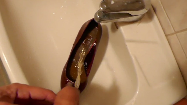 Piss in red stiletto high heel