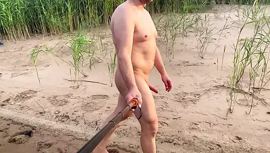 Spcer naked by the river, in public