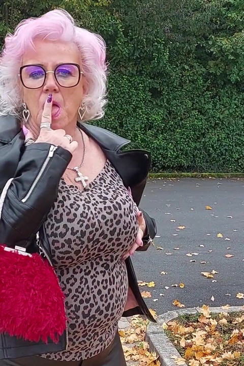 Naughty Granny Tongue Out Flashing Big Tits in Public