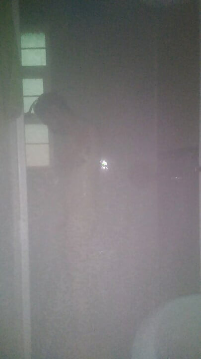 Man Showering with Flashlight On