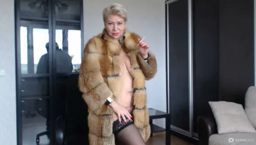 Hot sexy Russian MILF slut in a fur coat and a cigarette...