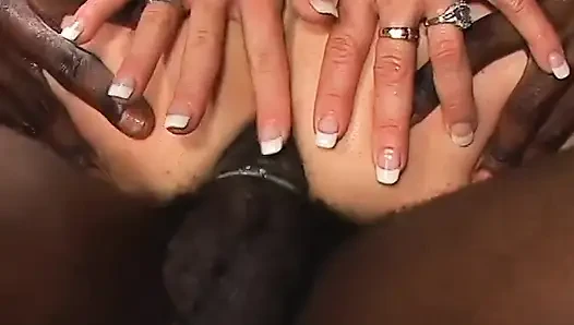 Bisexual threesome with brunette using strapon to fuck with the interracial male duo