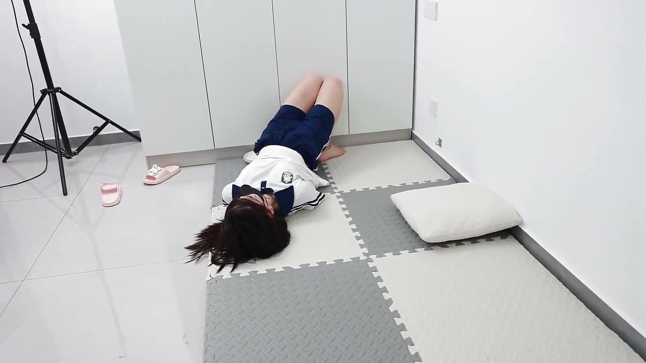 In a Couples' Game, the Girlfriend Must Pick up Coins Under the Constraints of Handcuffs and Shackles