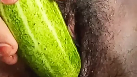 Teen college girl masterbating using cucumber