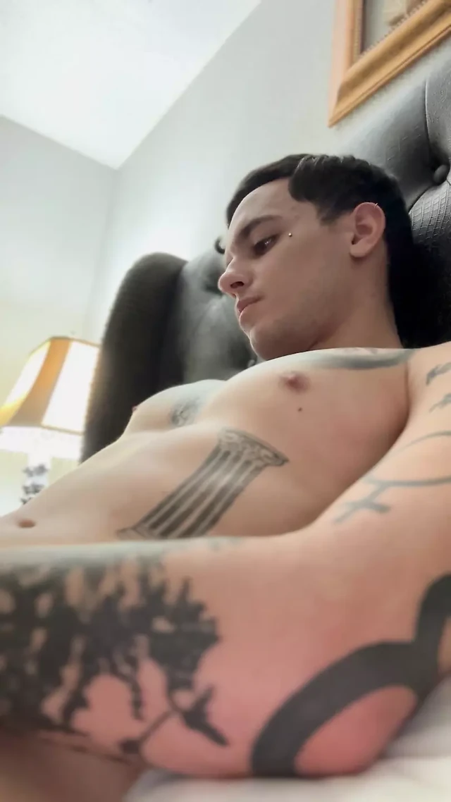 Adult starts to insert piercing into hole and pre
