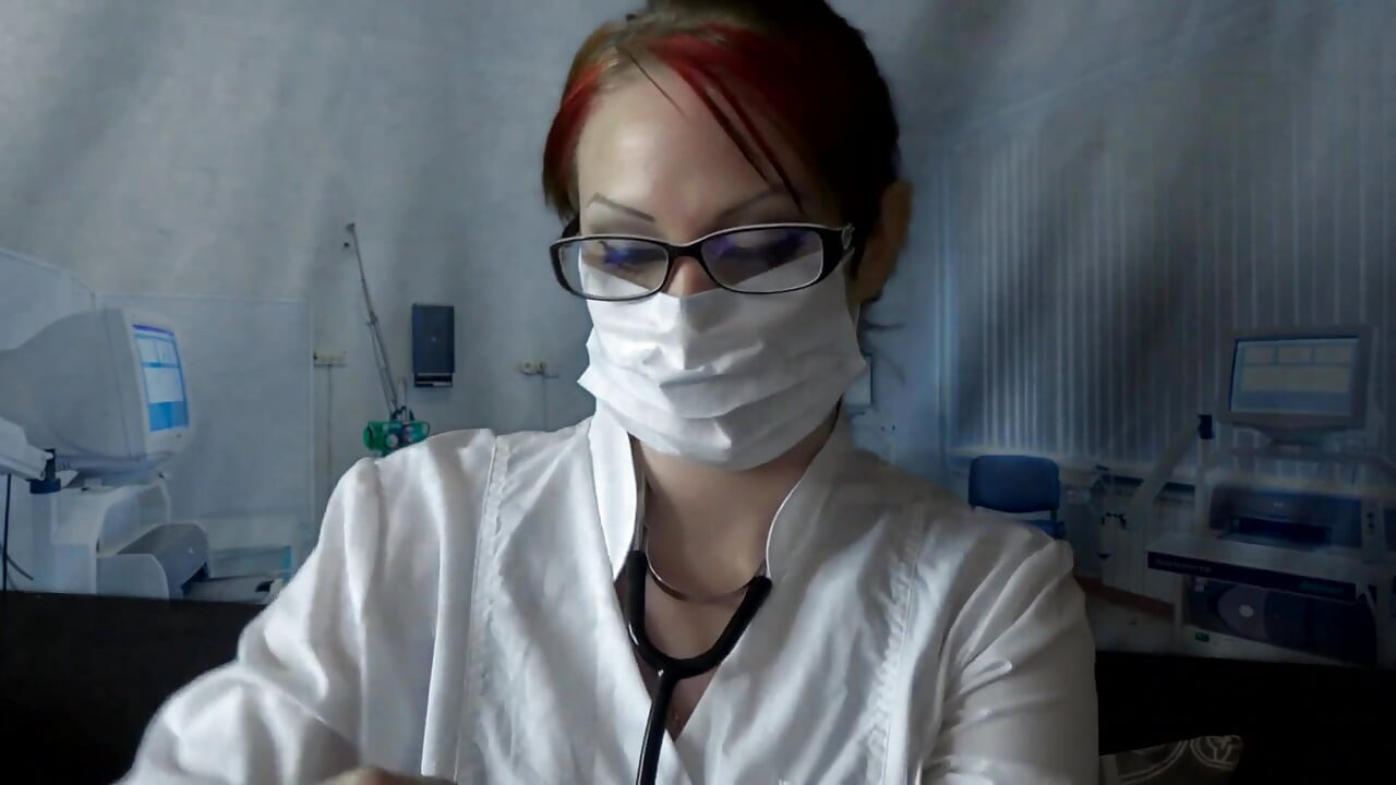 Doctor eating in medical mask and gloves