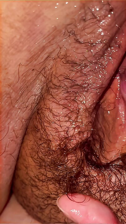 A lustful masseur caught the MILF off guard and licked her all over from behind, exploring her hairy pussy