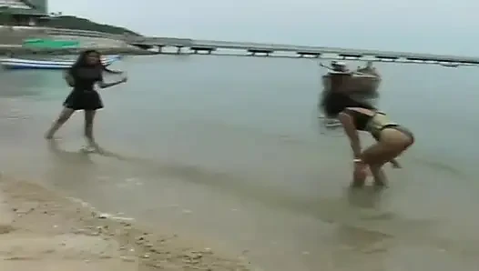 2 sexy Latina's presenting latex fetish in the pool and on the beach