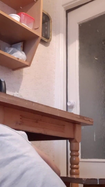 Memorable moment from "While our housekeeper was washing dishes, my girlfriend was riskily licking pussy under the table"