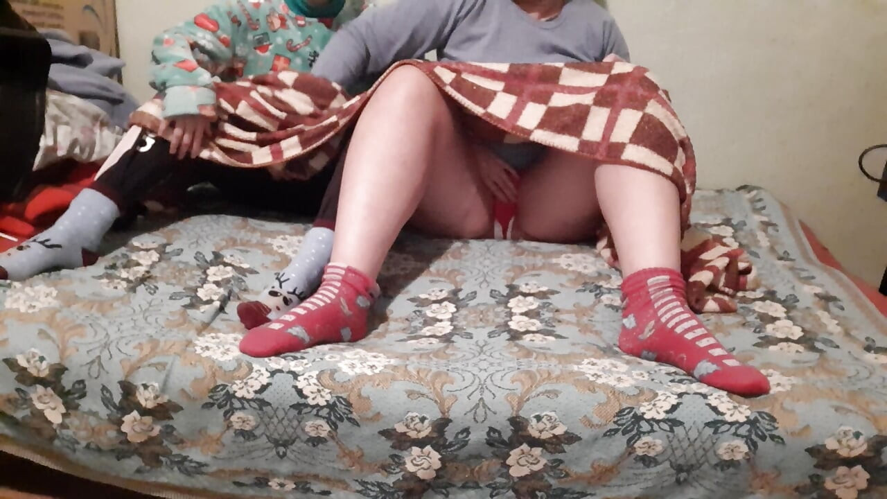 We mutual masturbate under the covers while our stepparents watch a movie next to us