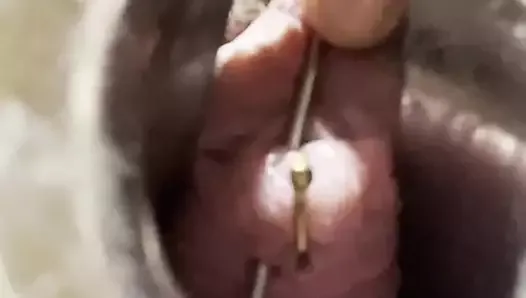 Urethral piercing