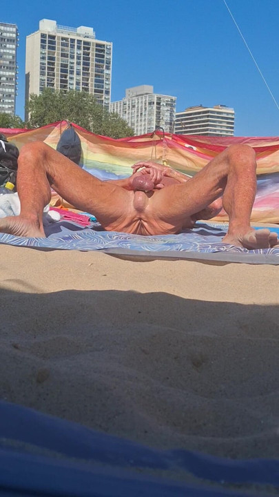 Key West stroking his cock at the beach