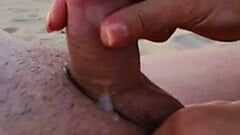 Happy small dick jerked on the beach
