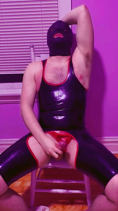 Playing with myself in my rubber chapsuit and thong