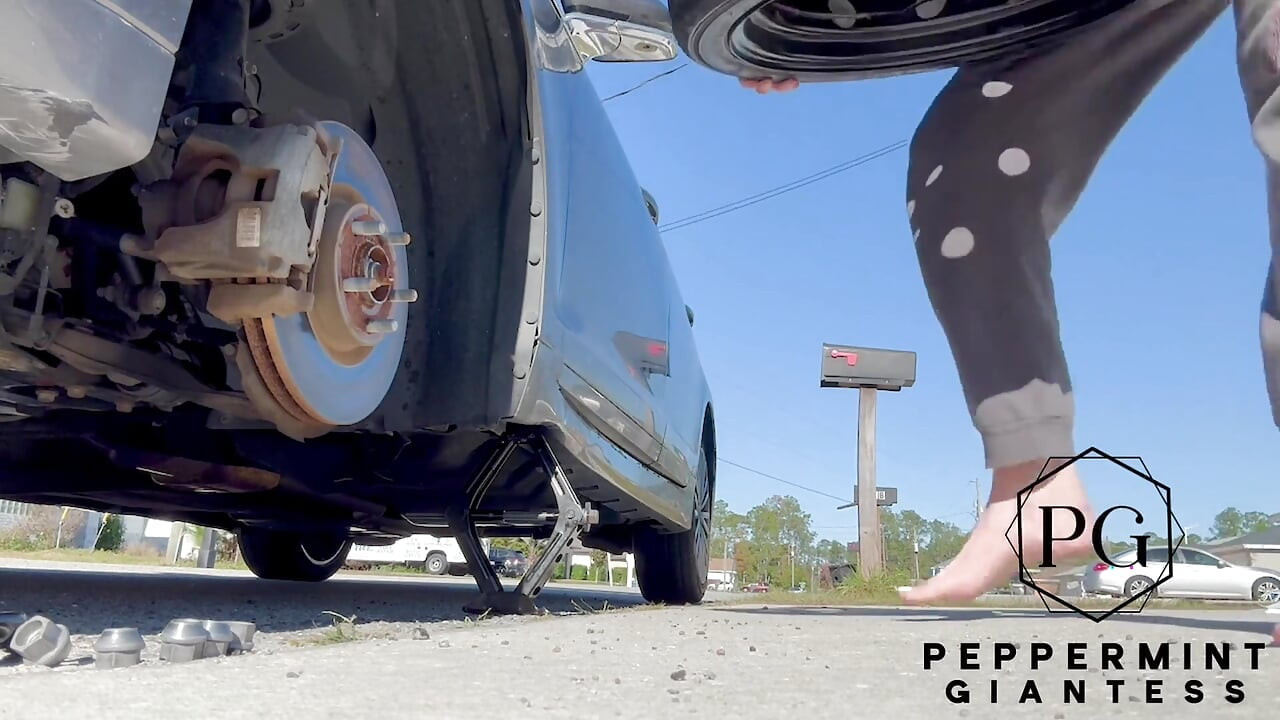 67 Tall Amazon Goddess Changes Her Tire - Big Feet in Frame