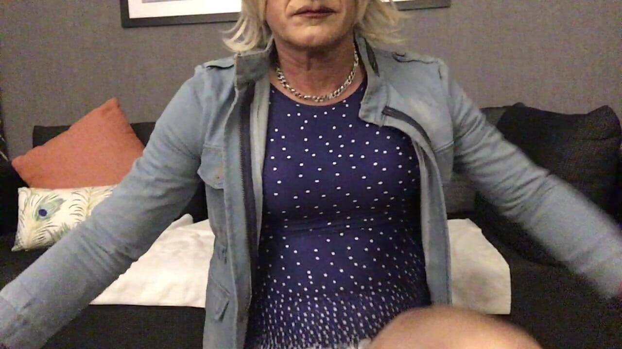 Tranny spreading pantyhose legs in  blue tight minidress and denim jacket
