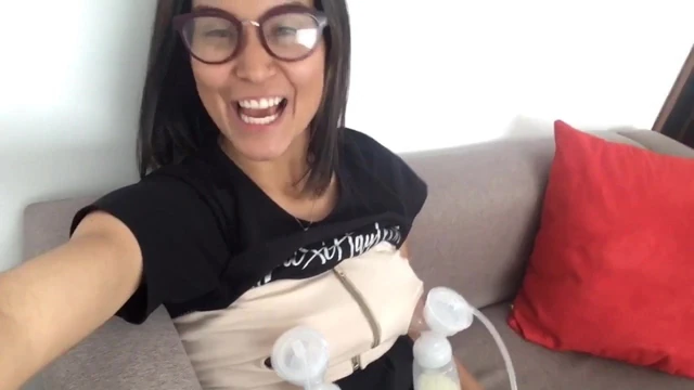 Petite Latina pumping milk from both her big nipples