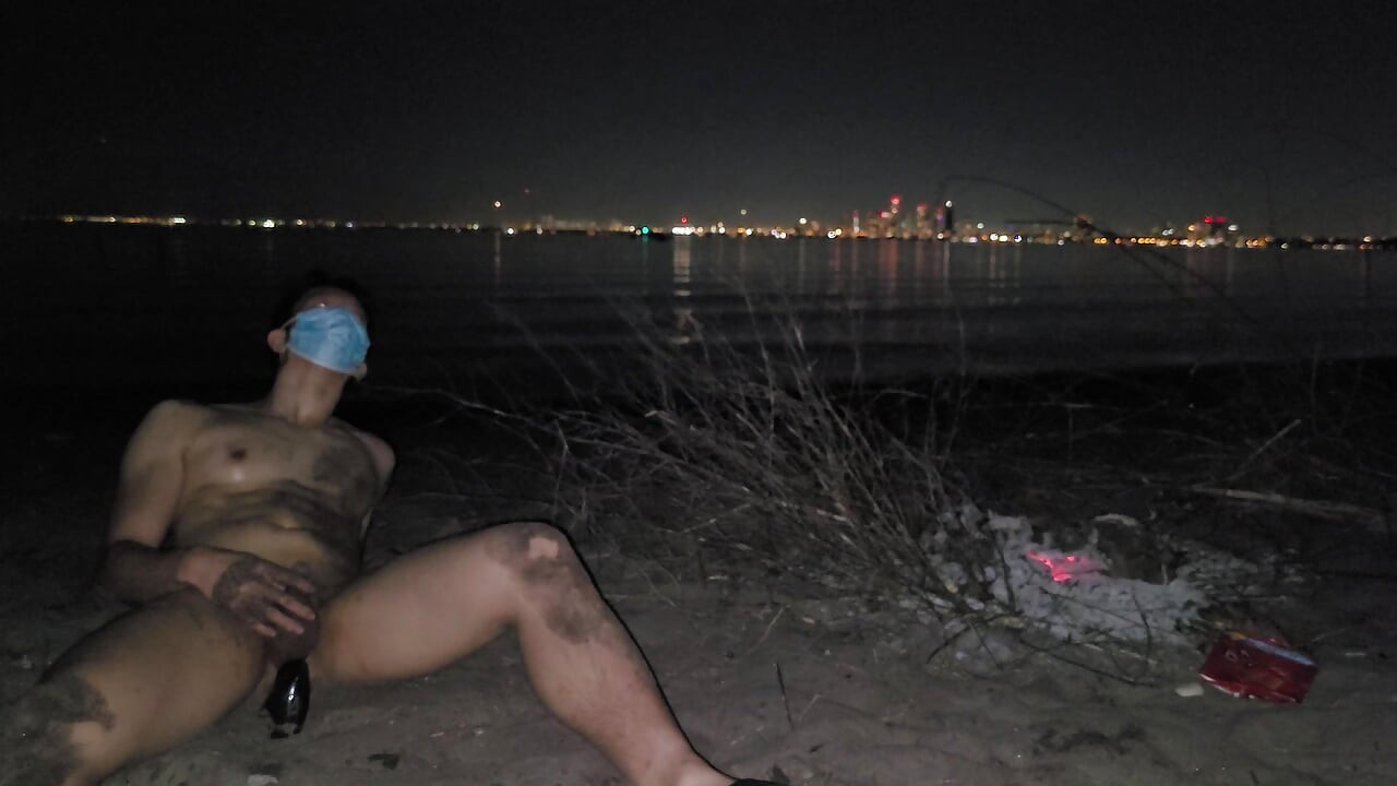 oiled masturbating and piss on the nude beach at night