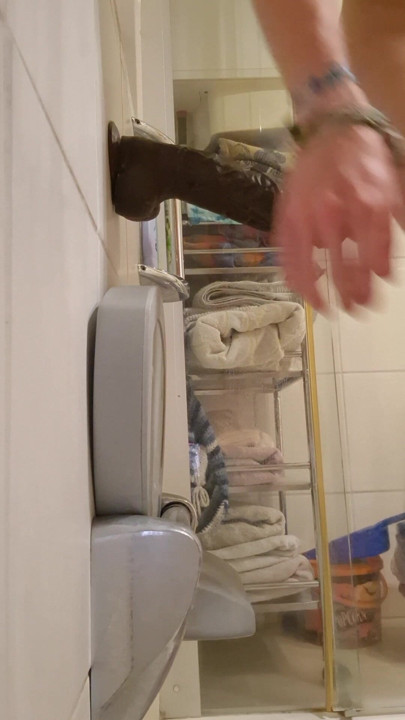 BBC dildo in the shower in the cage
