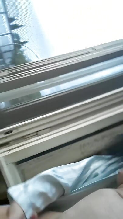 Naked in Front of the Window on a Chair