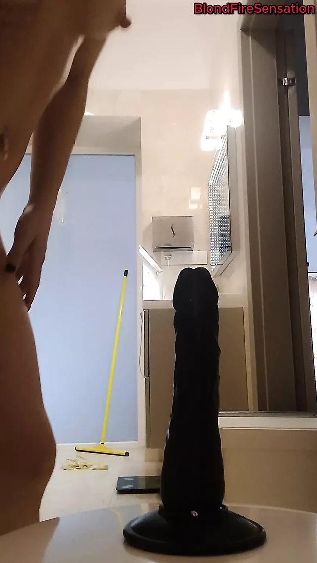 Riding a black dildo