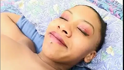 Guy gets his cock sucked by a black pregnant whore on the bed