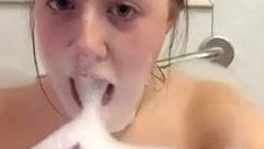 Sexy babe playing with bath bubbles - chokes