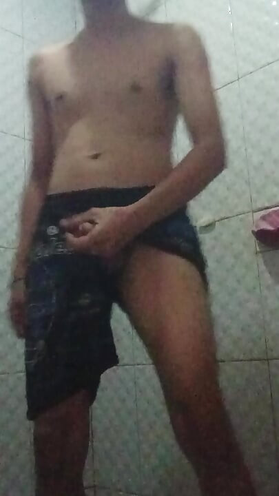 standing jerking off in a public toilet