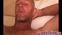 Rough older guy strips naked and tugs on his big hard cock