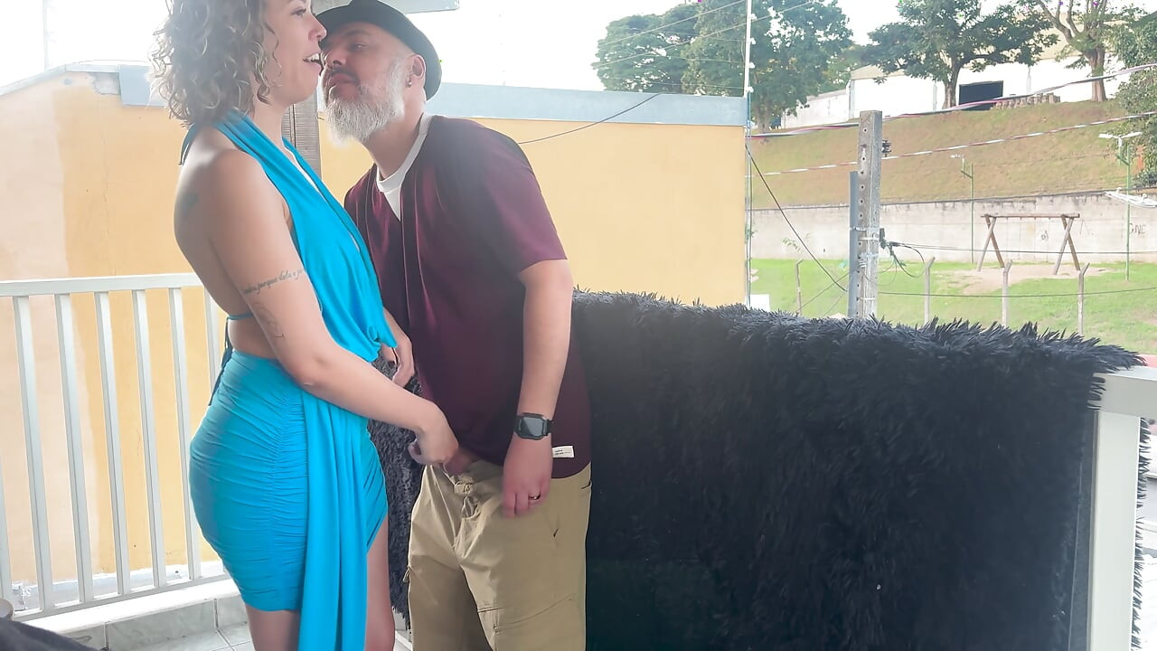 Strangers making out on a balcony during the party.