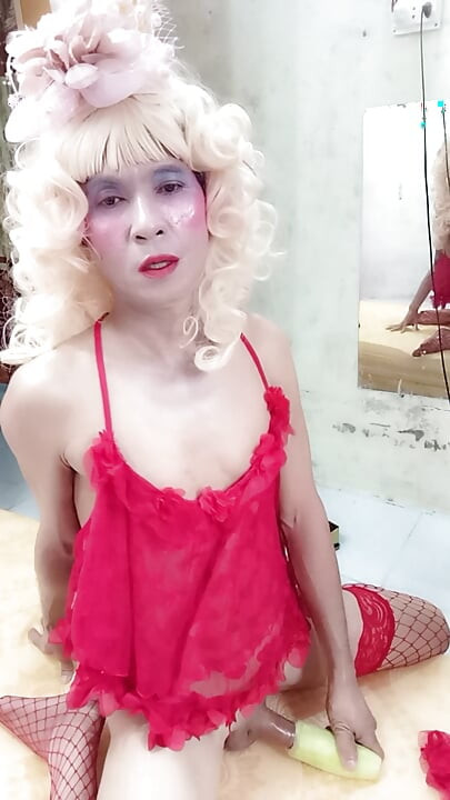 Oanh Le transgender wearing suggestive clothes to play with cans pretending to be too happy