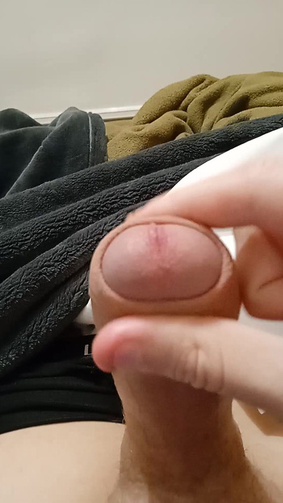 Handsome guy jerking off at home