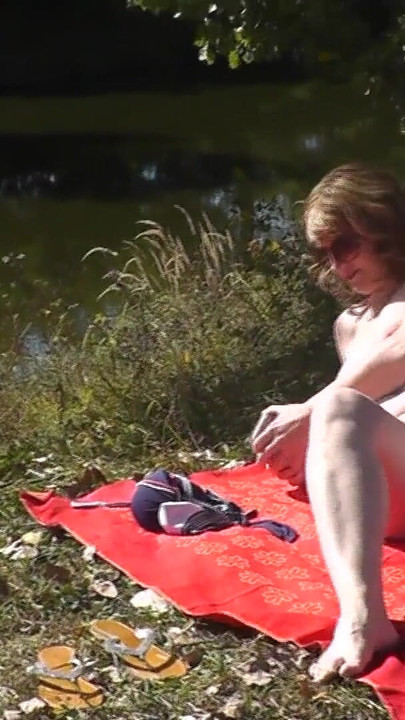 Captivating moment from "Outside, nature, by the river, naked MILF has wild masturbation"