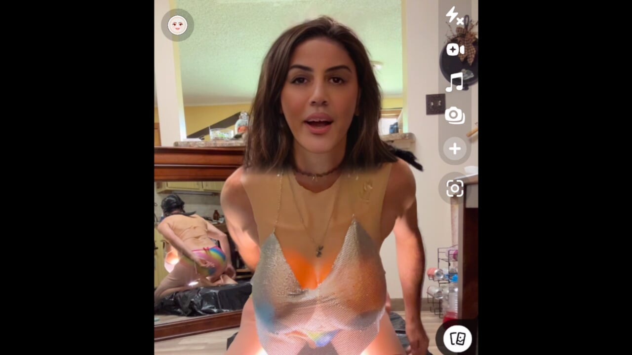 Shemale wearing see-through chainmail top shows off her nice rack