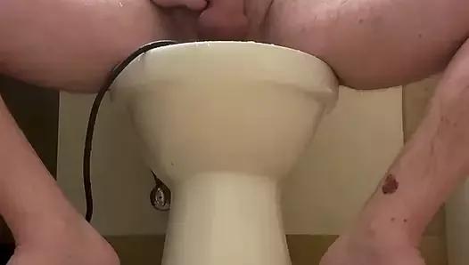 Sitting on the toilet Pissing on myself with a plus in my Ass