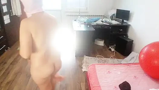 Amateur woman has fun trying on clothes and cutting them.