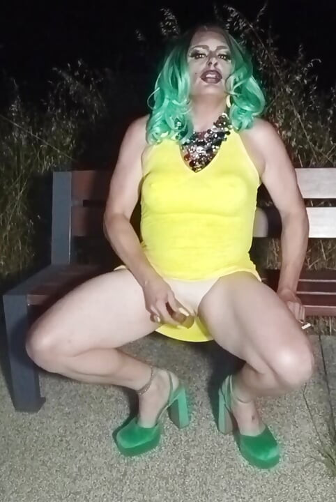 Sexy mature transvestite slut party summer showing off in a public park