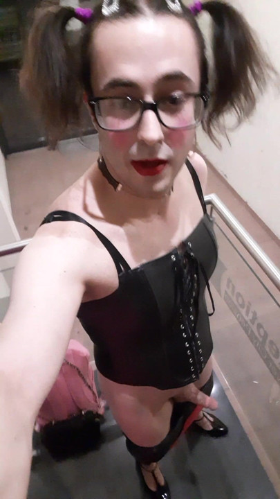 Sissyslut in front of the hotel entrance