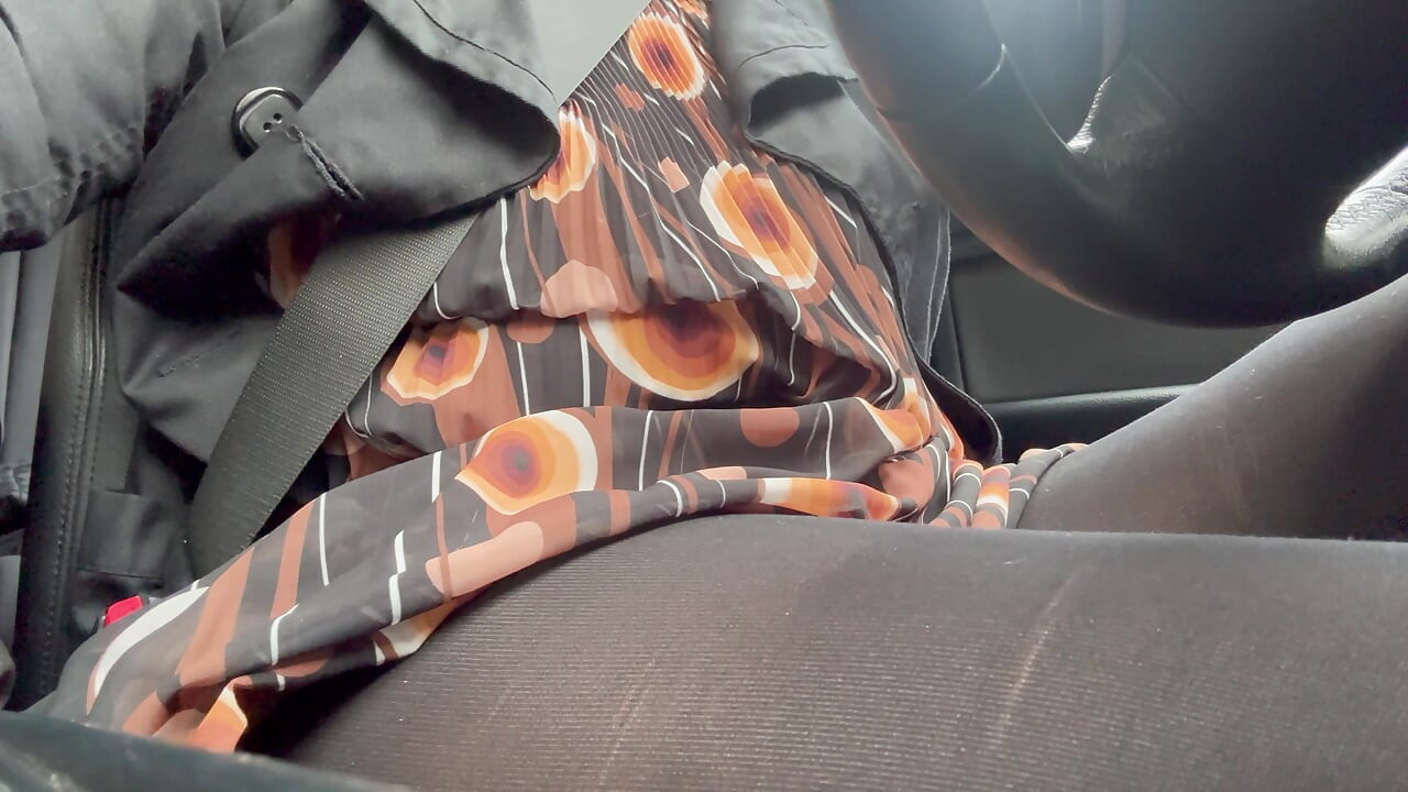 Elegant stepmom drives to the office wearing tights and a beautiful dress