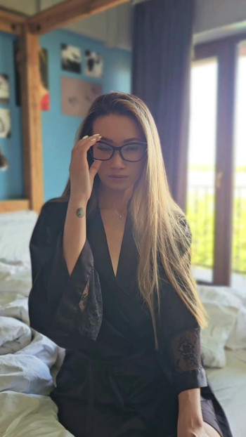 Hot asian woman with glasses in silk robe
