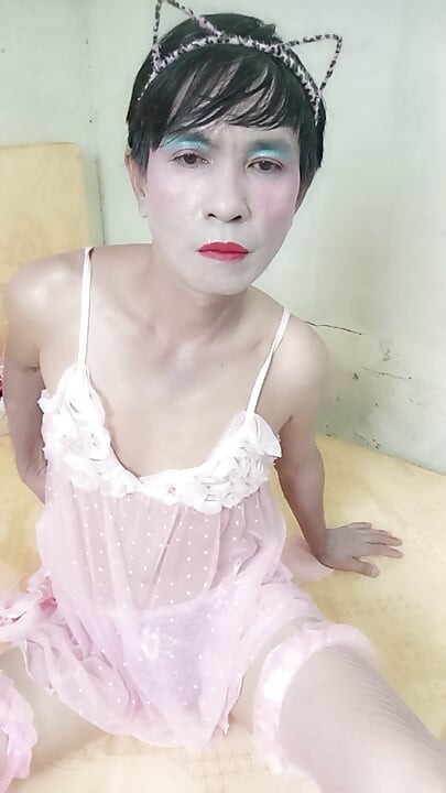 Oanh Le transgender wearing a sexy robe masturbating happily