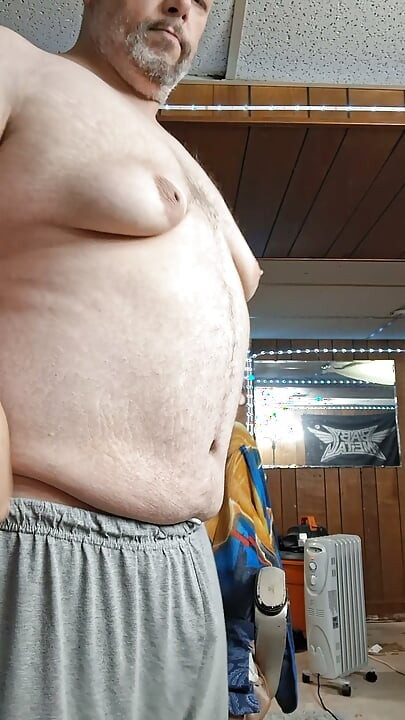 Chubby guy stands and cums