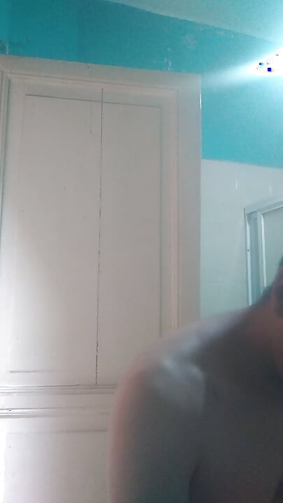 Man washes his face