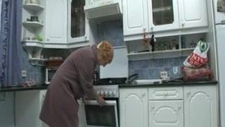 grandmother masturbates in the kitchen