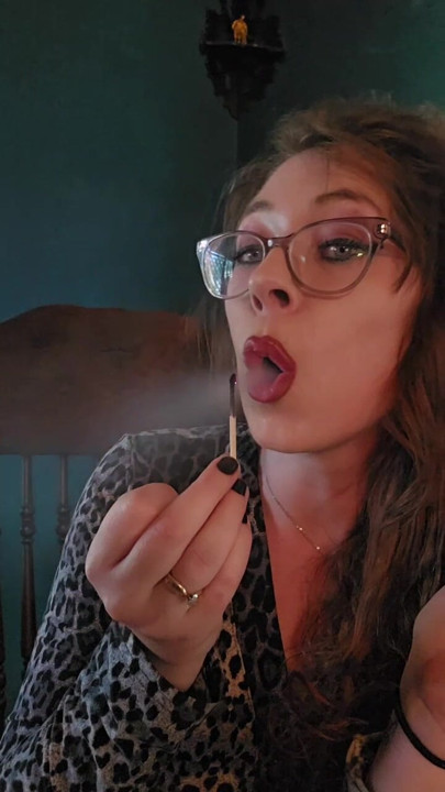 Cigarette Dangling while lighting a match